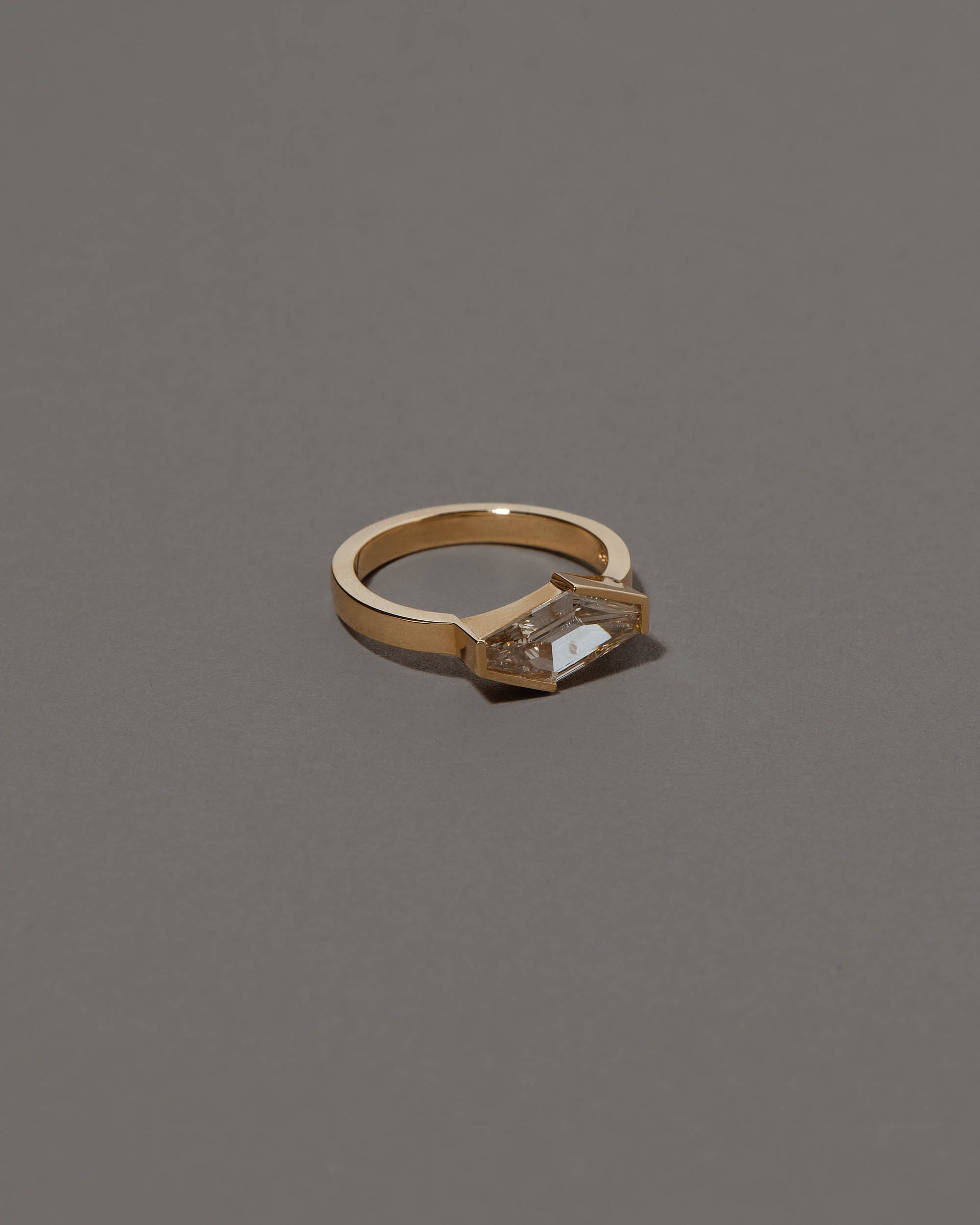 View from the side of the Mirth Ring on grey color background.