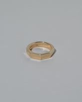 Gold 5mm Segmented Half Hoop Band on light color background.