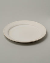 Tracie Hervy Dinner Plate on light color background.
