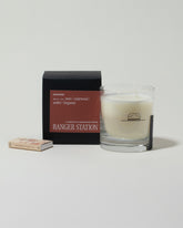 Ranger Station Oakmoss Candle with matchbox on light color background.