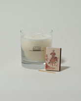 Closeup details of the Ranger Station Oakmoss Candle with matchbox on light color background.
