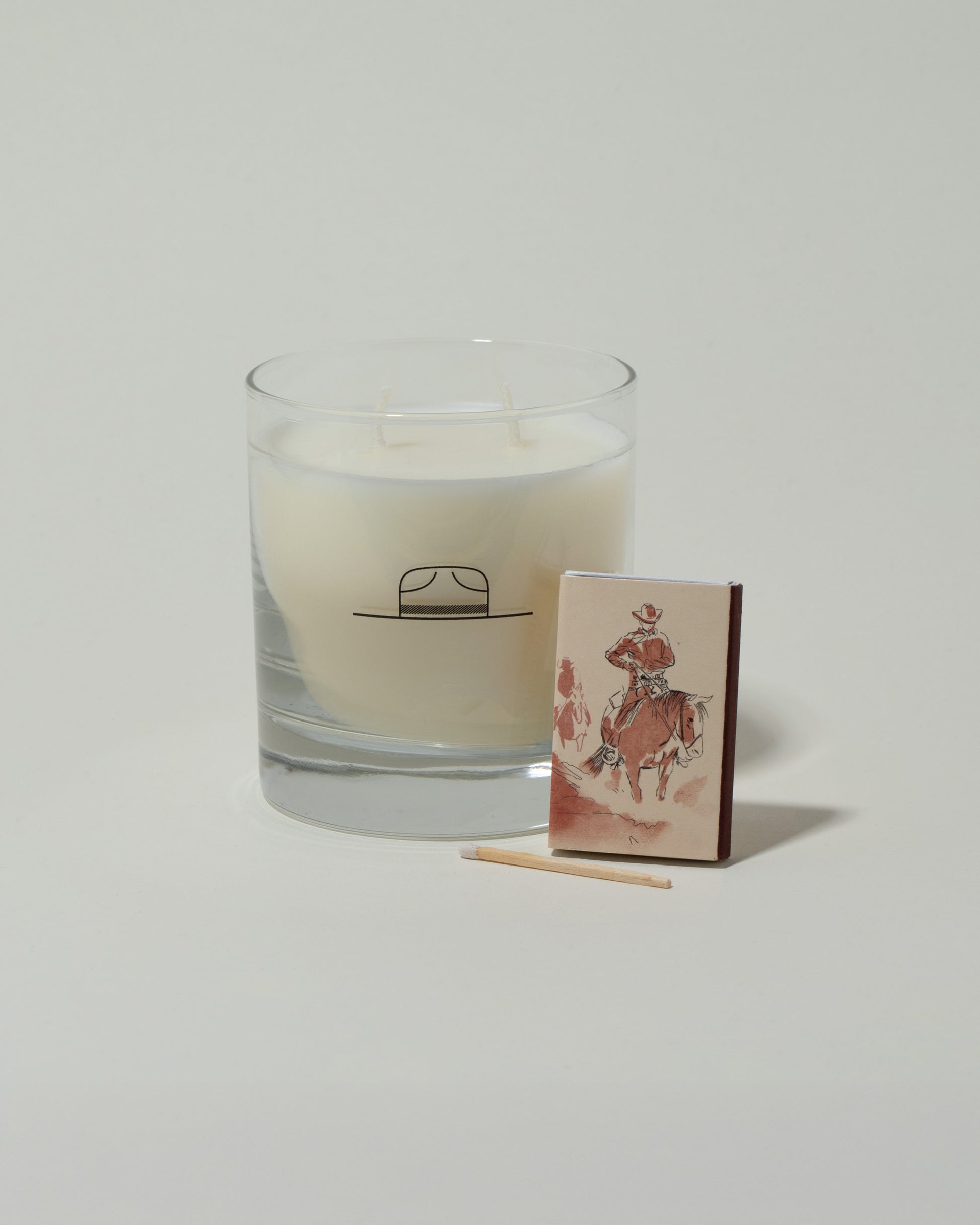 Closeup details of the Ranger Station Santalum Candle with matchbox on light color background.