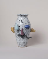 Recreation Center Apotropaia Efface Face Vase on light color background.