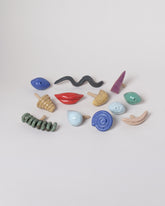 Detail view of the Recreation Center Apotropaia Efface Face Vase attachments on light color background.