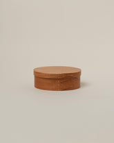 Rikke Falkow Extra Small Cherry Wood Oval Box on light color background.