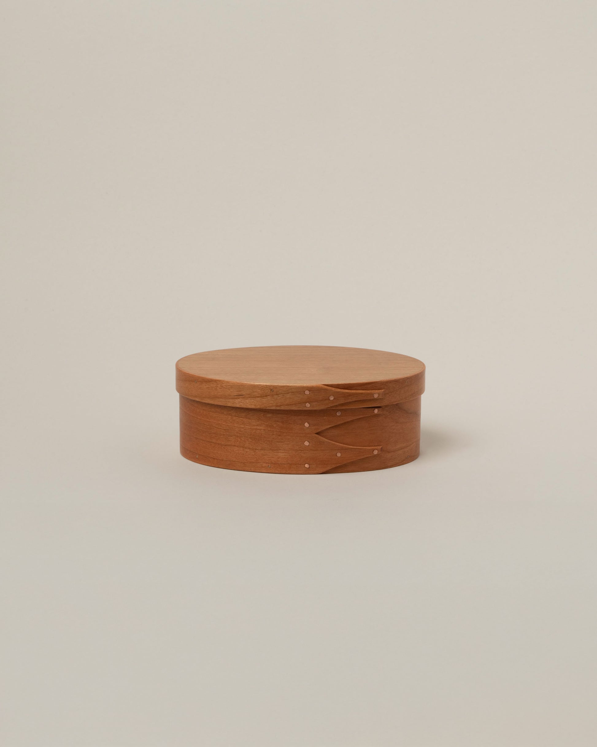 Rikke Falkow Extra Small Cherry Wood Oval Box on light color background.