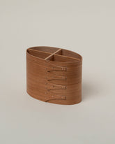 Closeup details of the Rikke Falkow Cherry Wood Pen Pot on light color background.