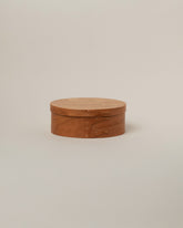Rikke Falkow Small Cherry Wood Oval Box on light color background.