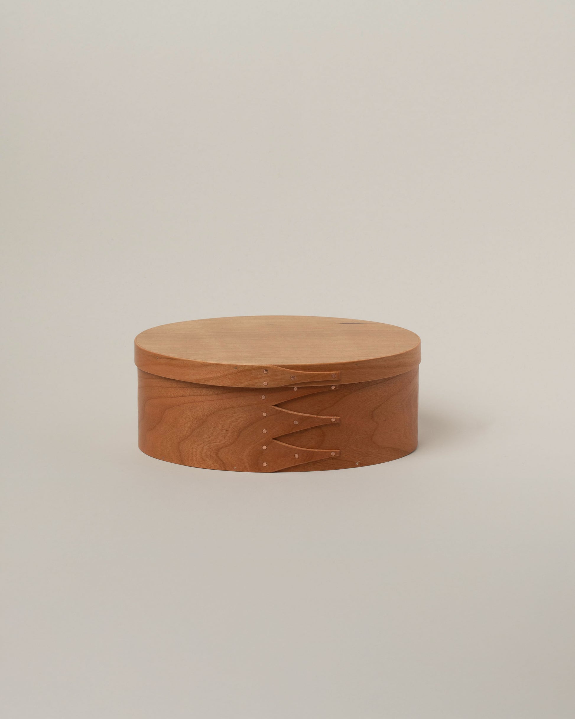 Rikke Falkow Medium Cherry Wood Oval Box on light color background.