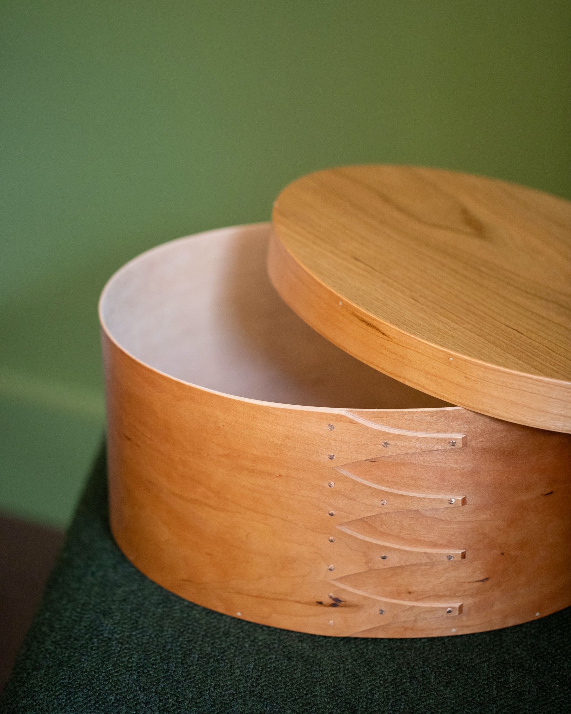Styled image featuring the Rikke Falkow Extra Large Cherry Wood Oval Box.