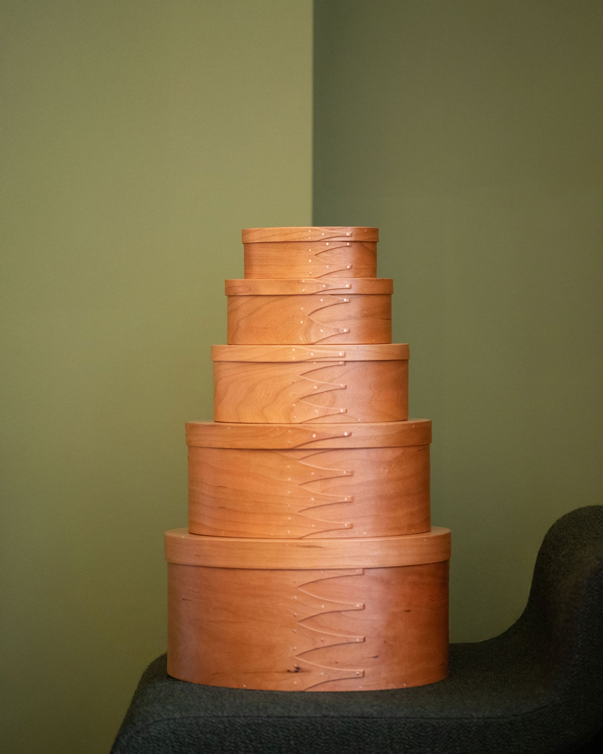 Styled image featuring the Rikke Falkow Cherry Wood Oval Boxes.