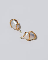 Weaver Earrings on light color background.