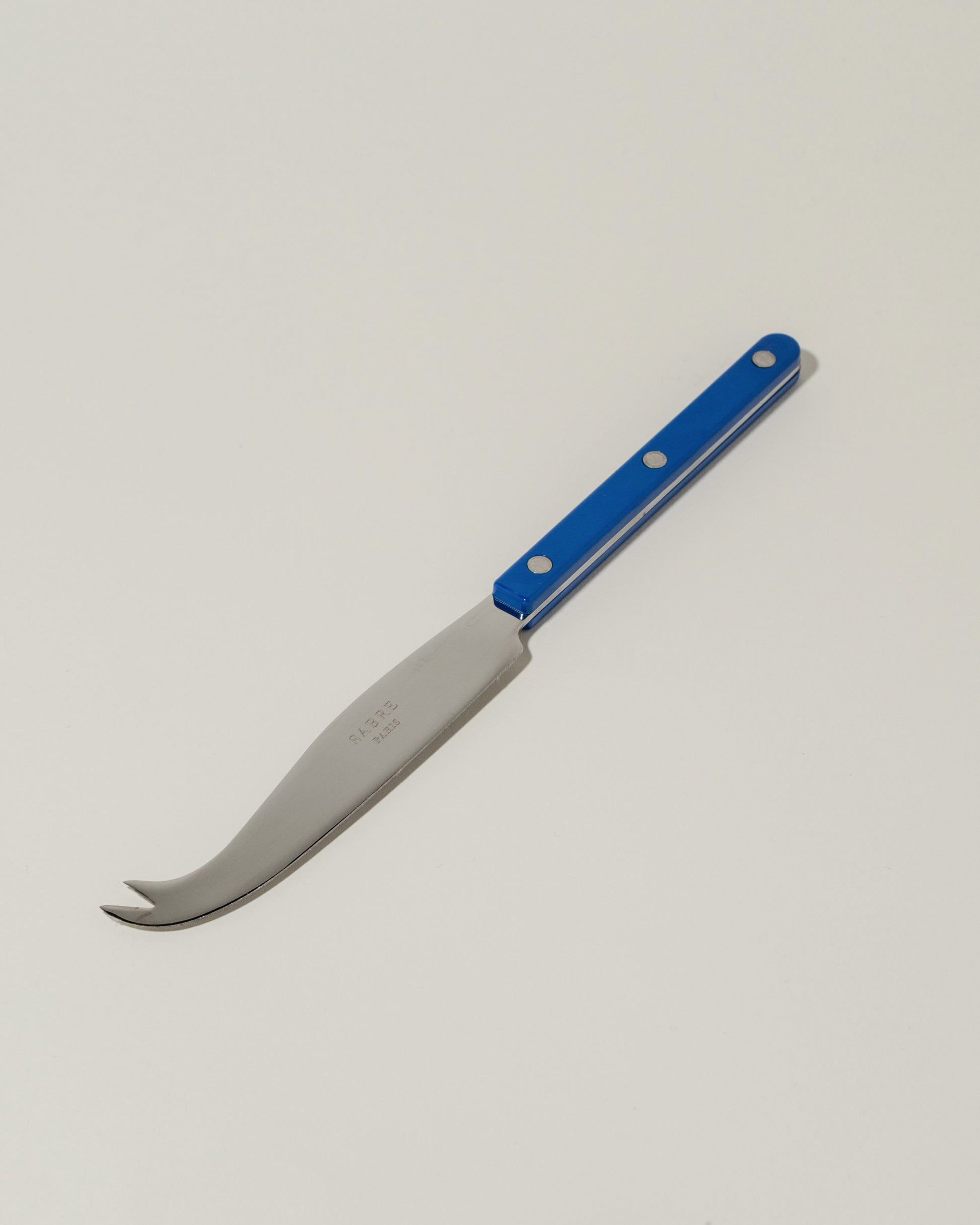 Sabre Paris Lapis Blue Cheese Knife on light color background.