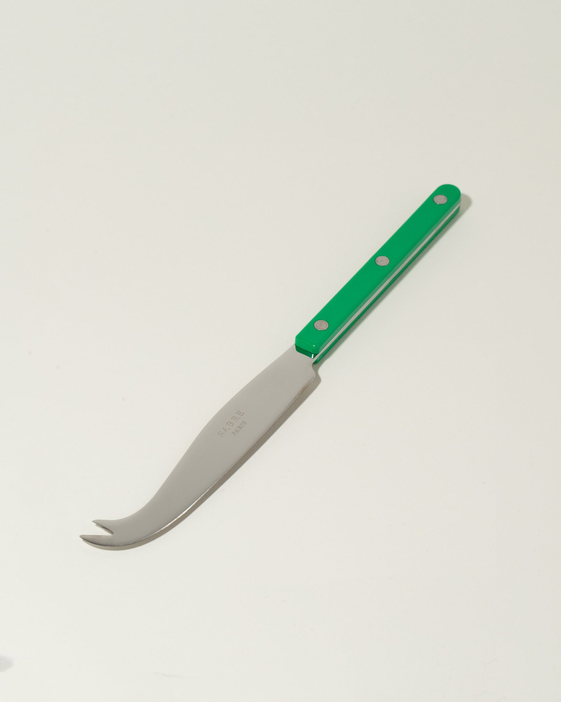 Sabre Paris Garden Green Cheese Knife on light color background.