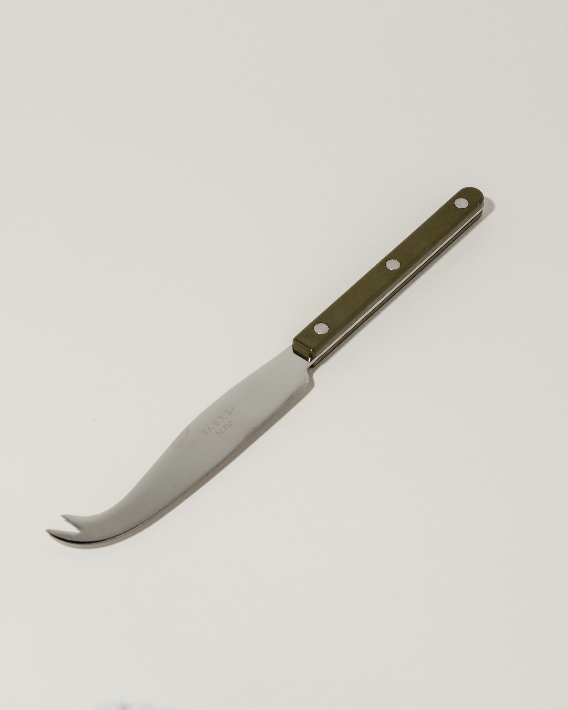 Sabre Paris Green Fern Cheese Knife on light color background.
