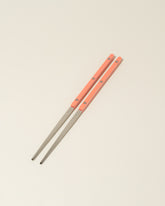 Sabre Paris Garden Green Chopsticks on light color background.