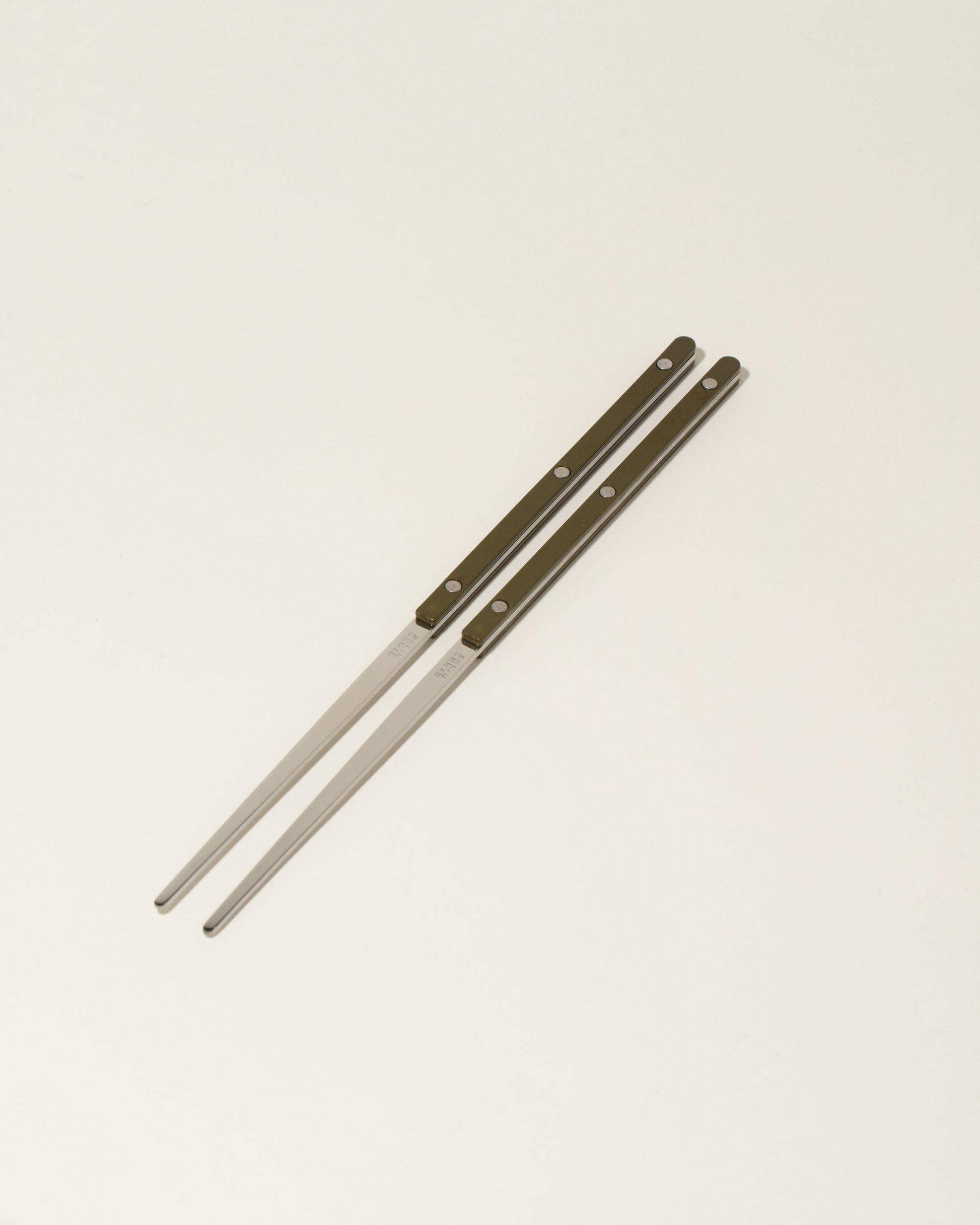 Sabre Paris Nude Pink Chopsticks on light color background.