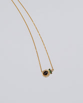 Mystical Change Necklace on light color background.