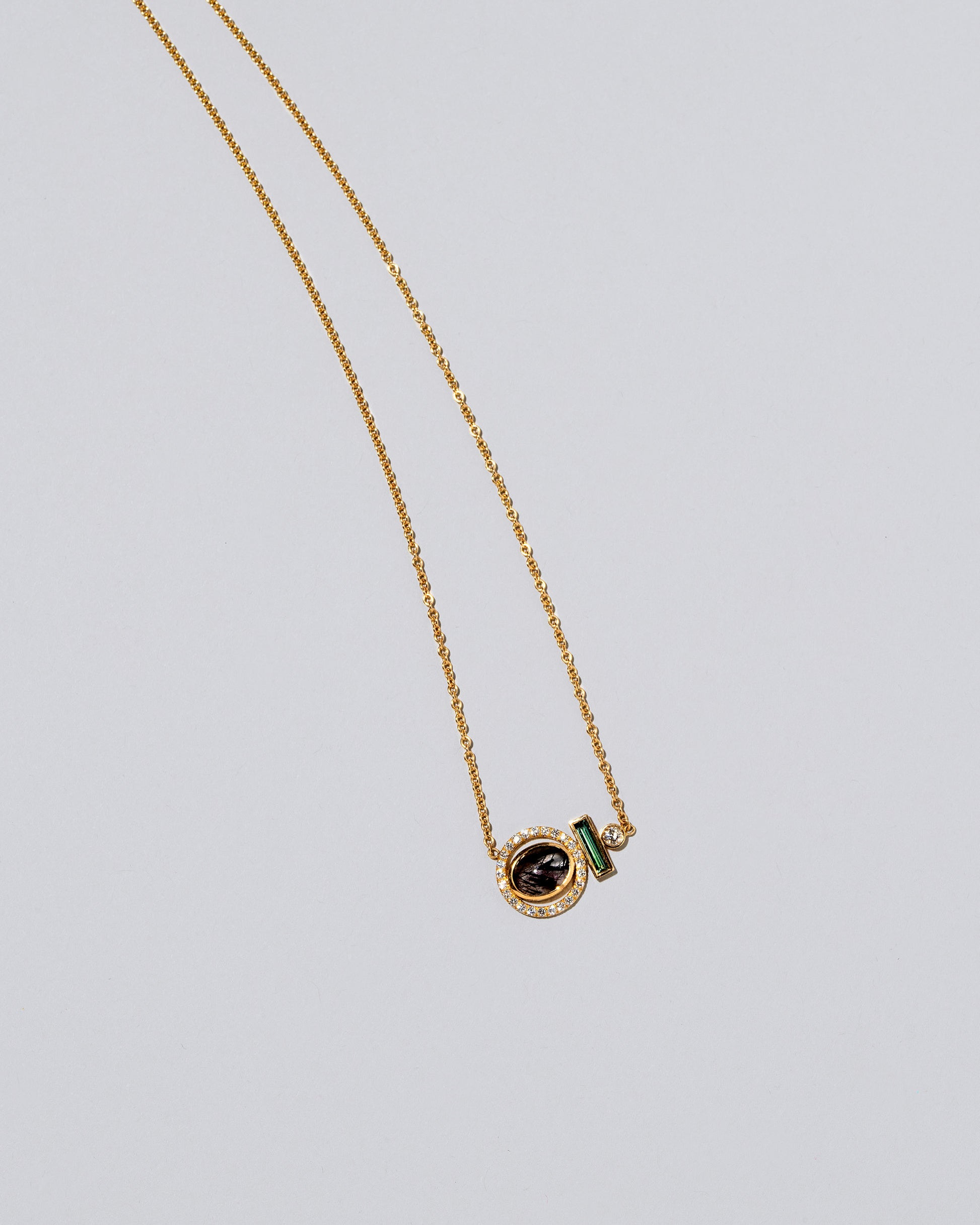 Mystical Change Necklace on light color background.