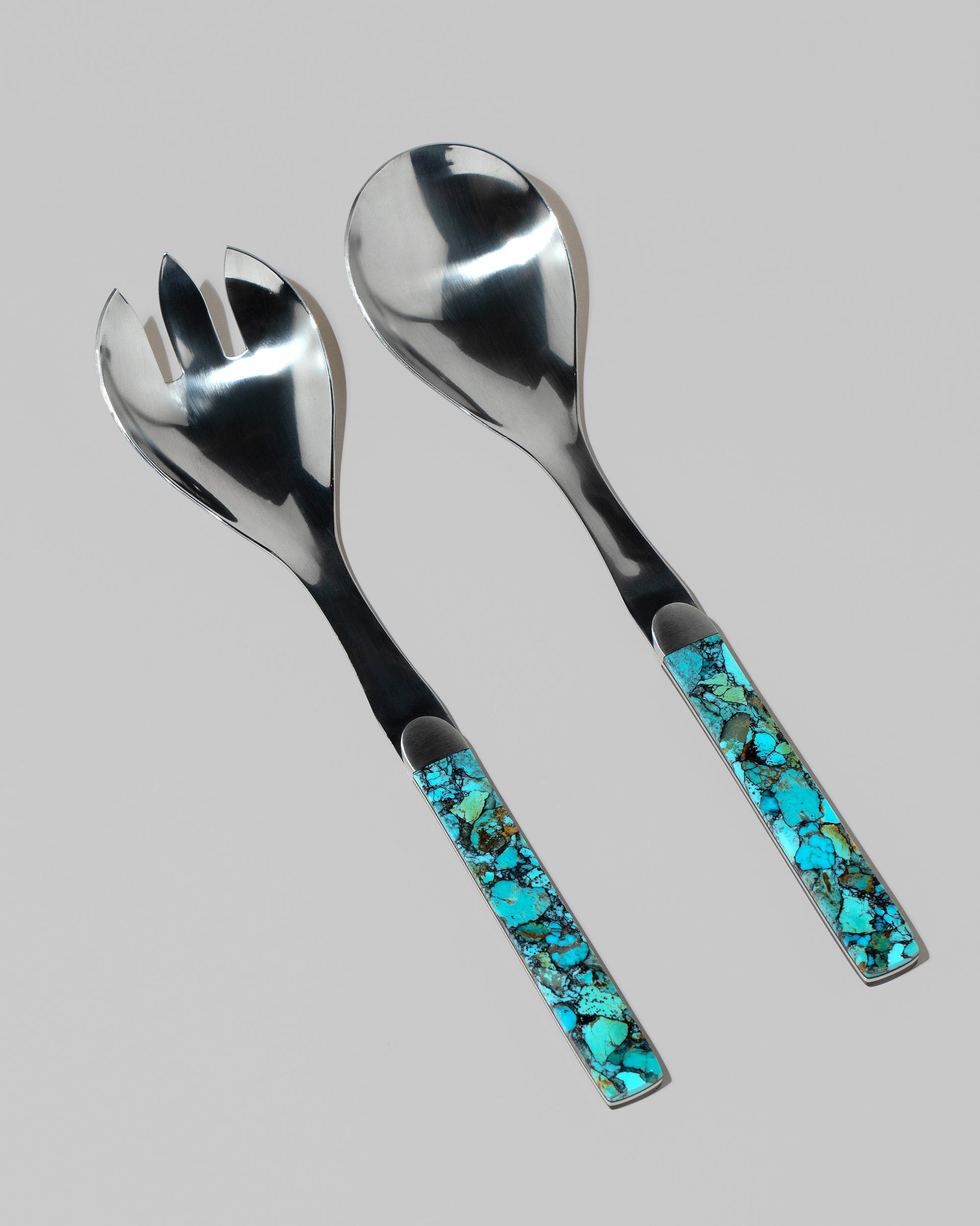 Santa Fe Stoneworks Kingmen Turquoise Salad Serving Set on light color background.