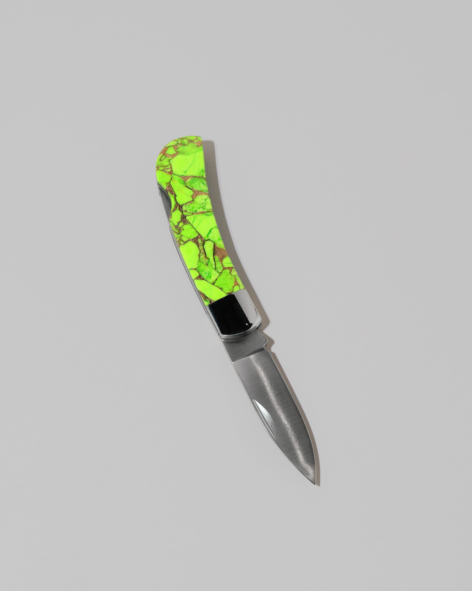 Santa Fe Stoneworks Neon Ranger Small Lockback Knife on light color background.