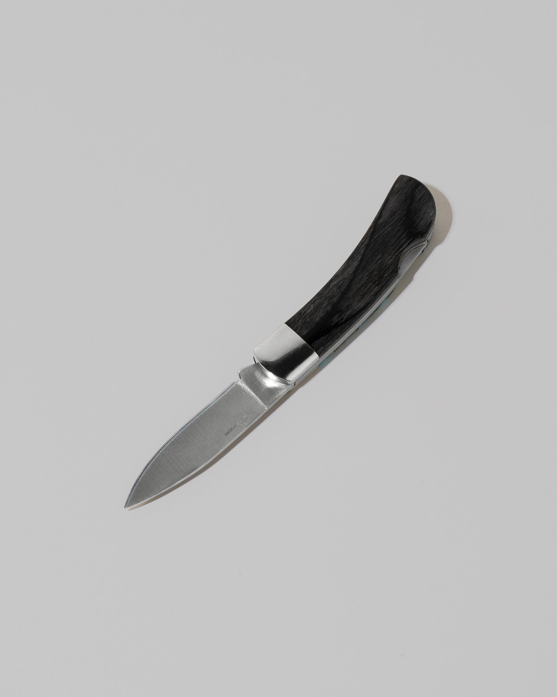 View from the back of the Small Lockback Knife on light color background.