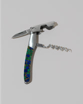 Detail view of the Santa Fe Stoneworks Azurite and Lapis Waiter's Knife on light color background.