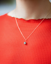 Bicolor Sapphire Pendant paired with chain on model.