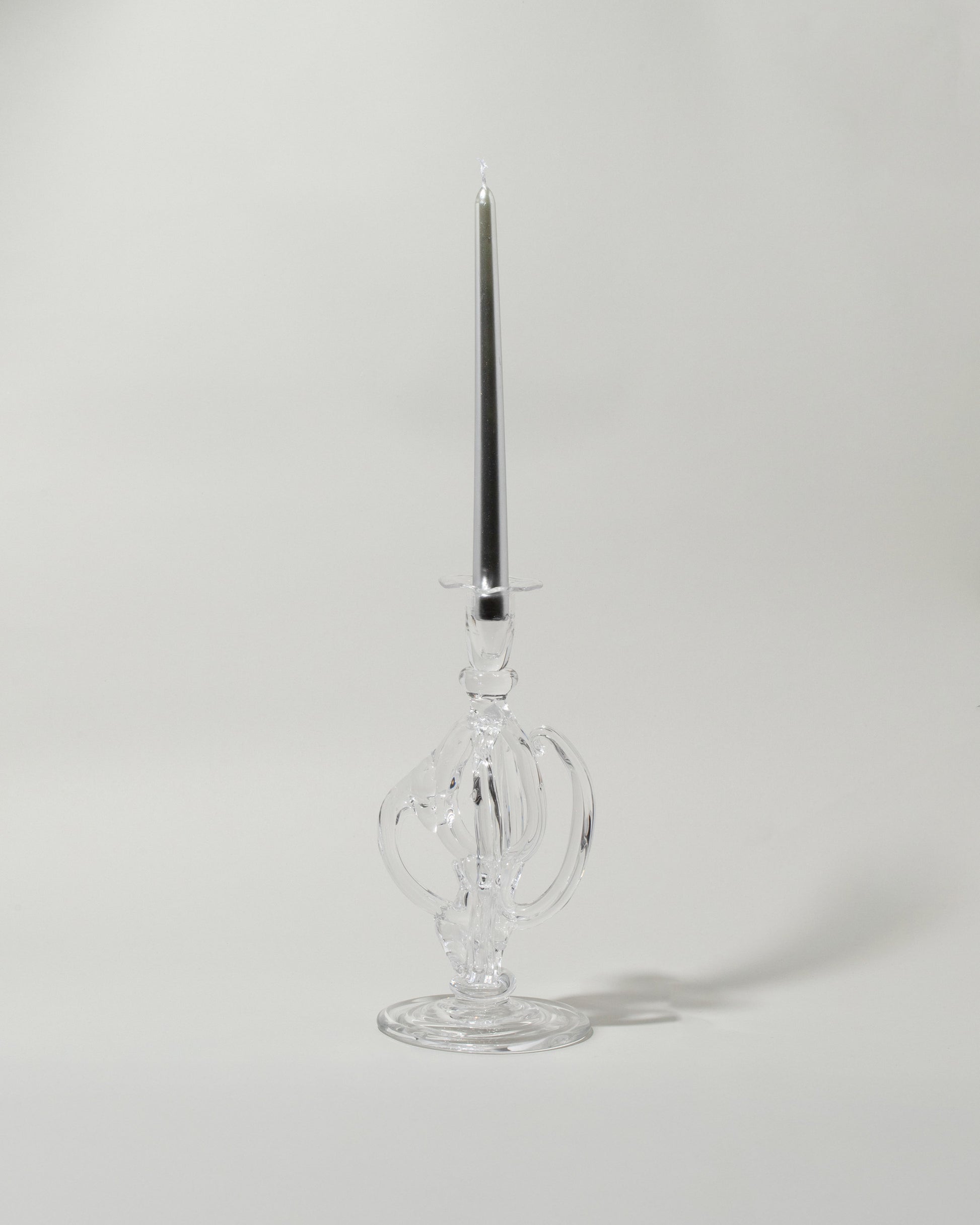 Detail view of the Silje Lindrup Five Glass Candle Holder on light color background. Taper not included.