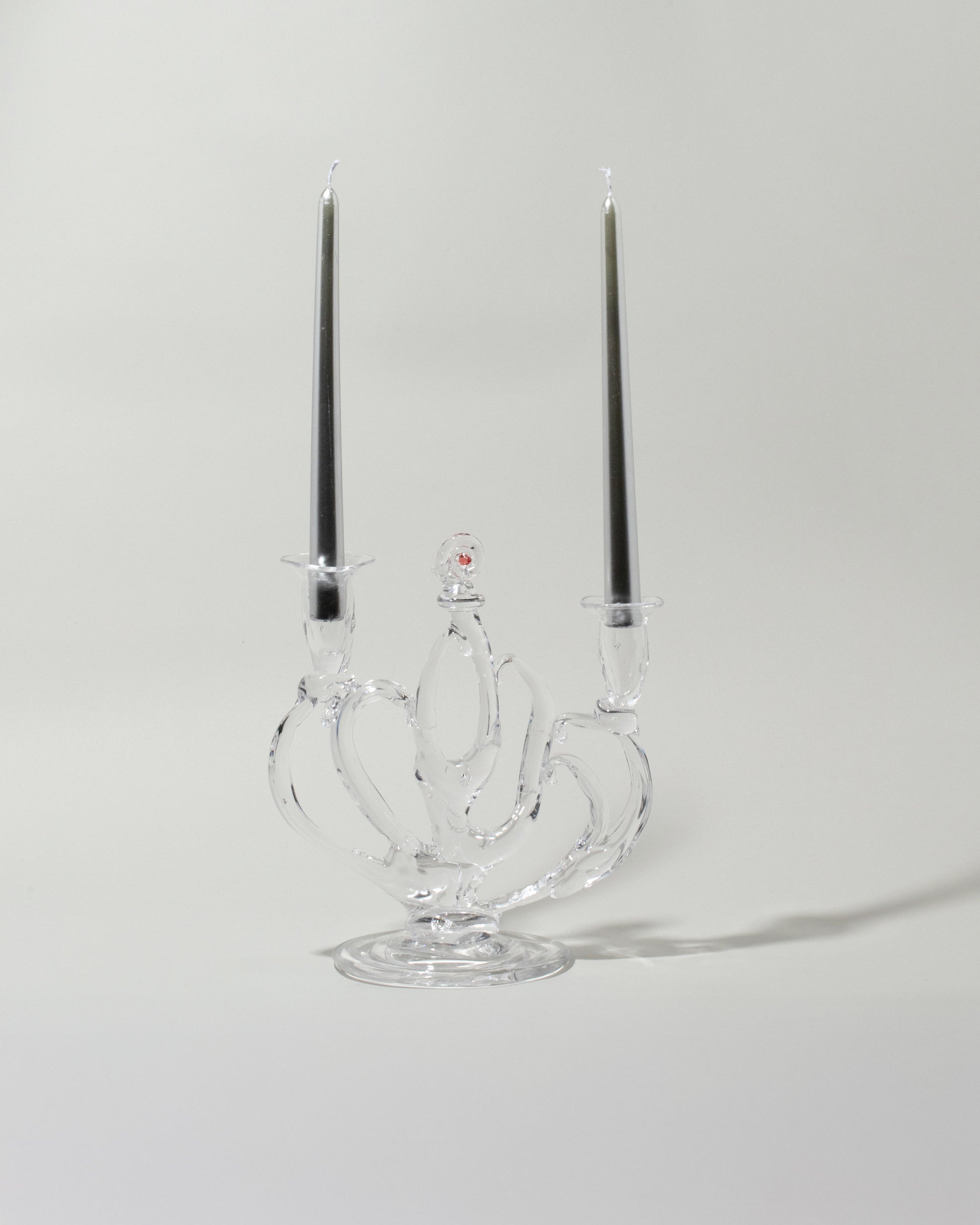 Detail view of the Silje Lindrup Four Glass Candelabra on light color background. Tapers not included.