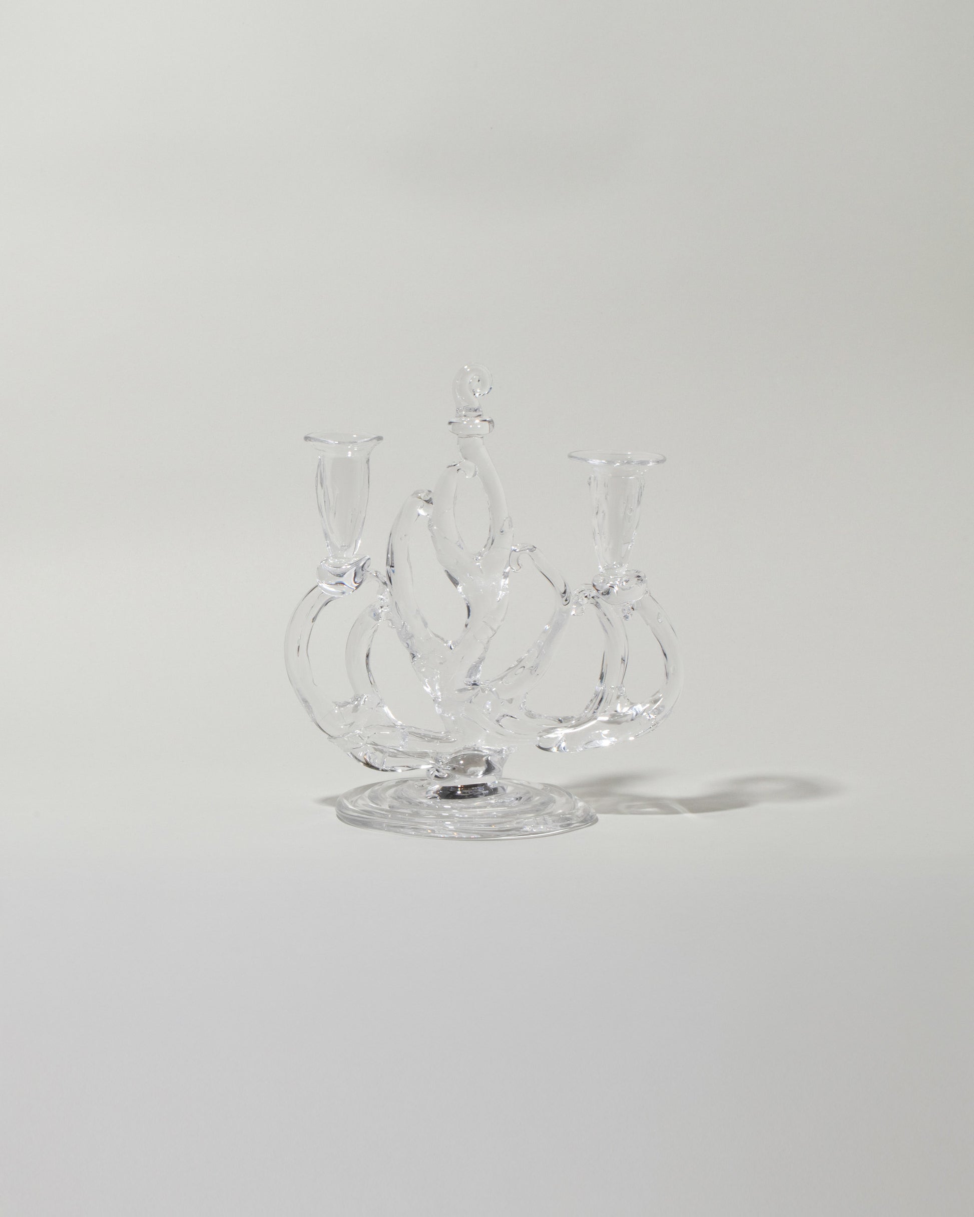 Silje Lindrup Two Glass Candelabra on light color background.