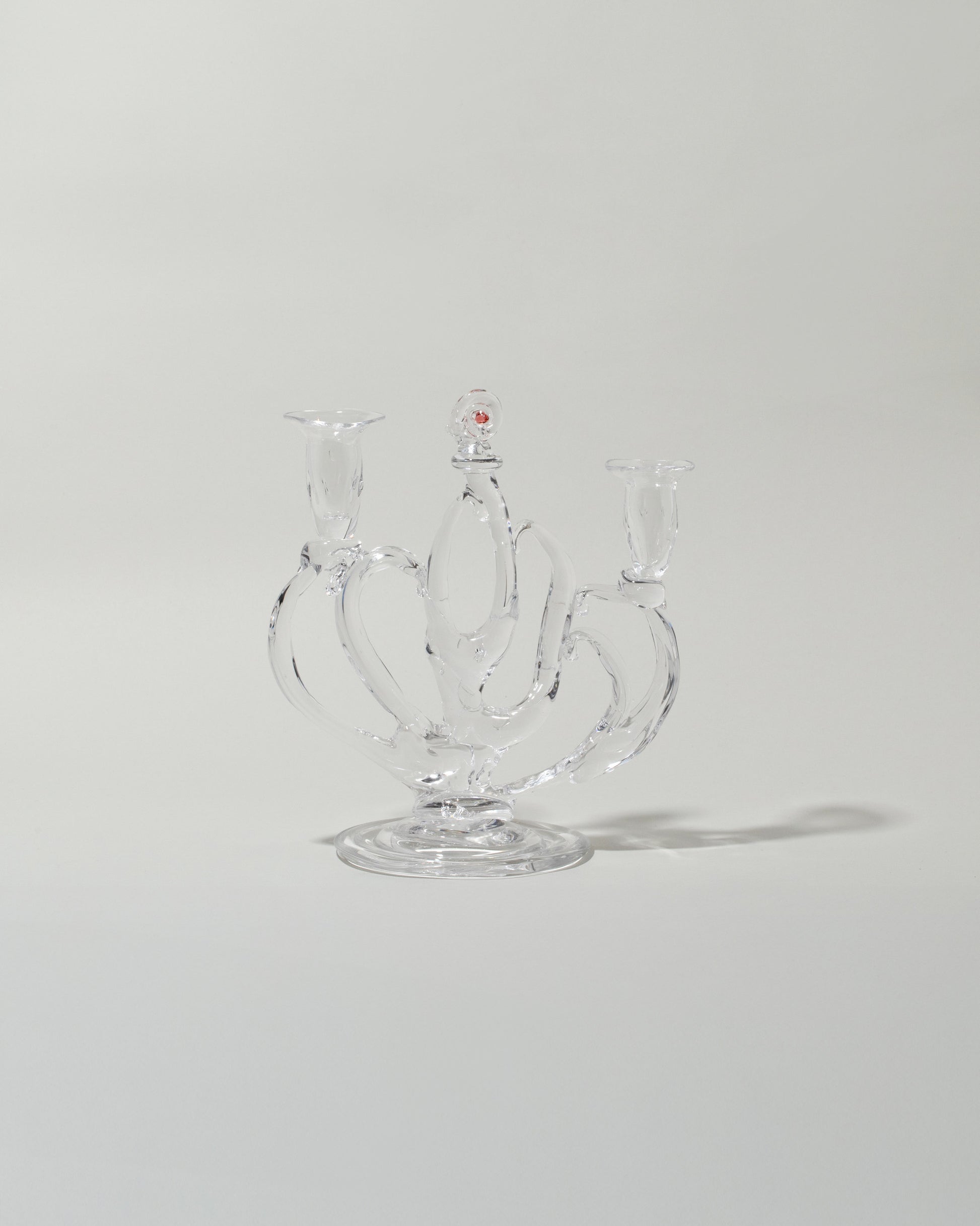 Silje Lindrup Four Glass Candelabra on light color background.