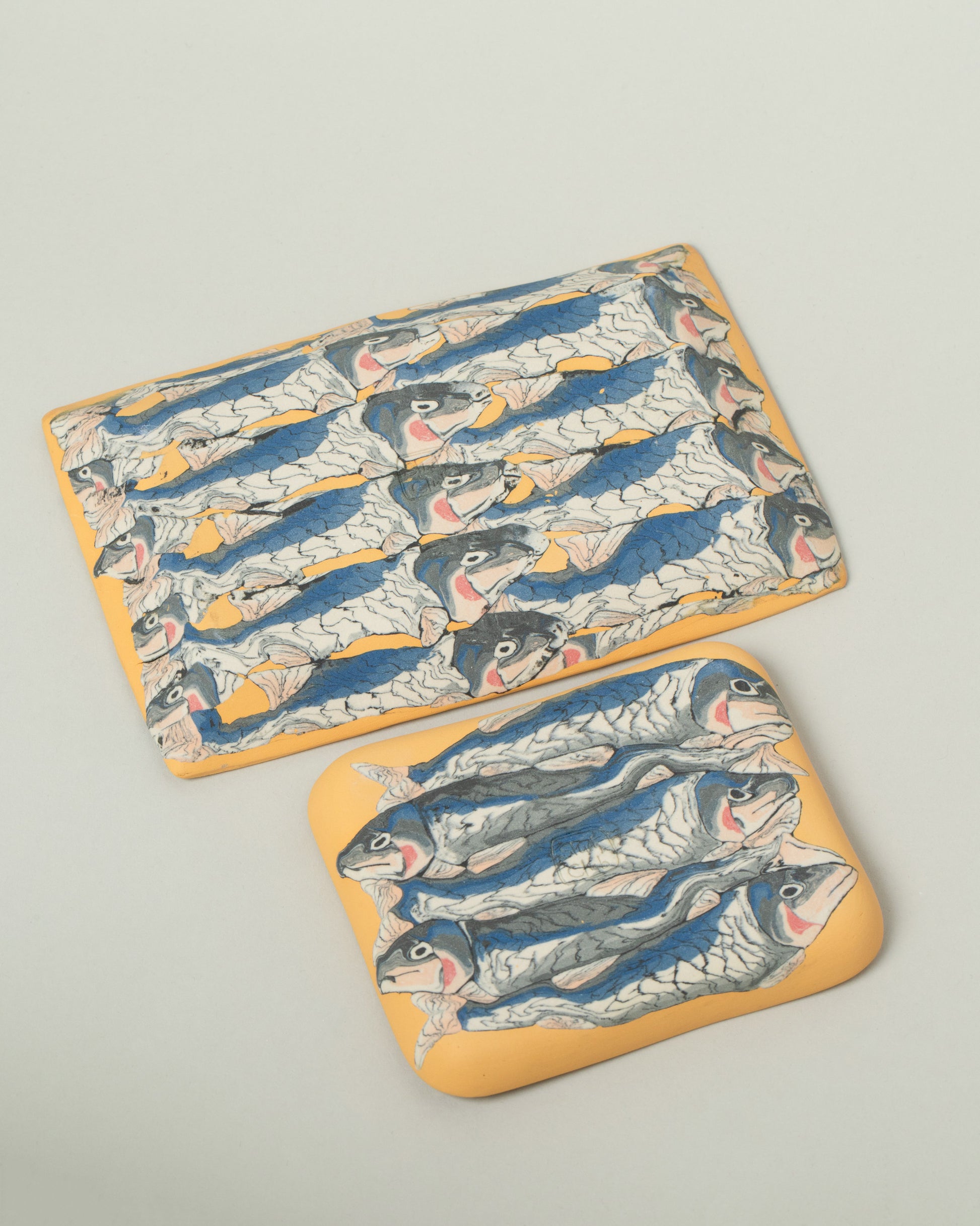 View from the back of the Slush Club Large and Small Nerikomi Sardine Trays on light color background.