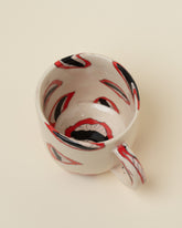 Closeup details of the Slush Club Nerikomi Lip Mug on light color background.