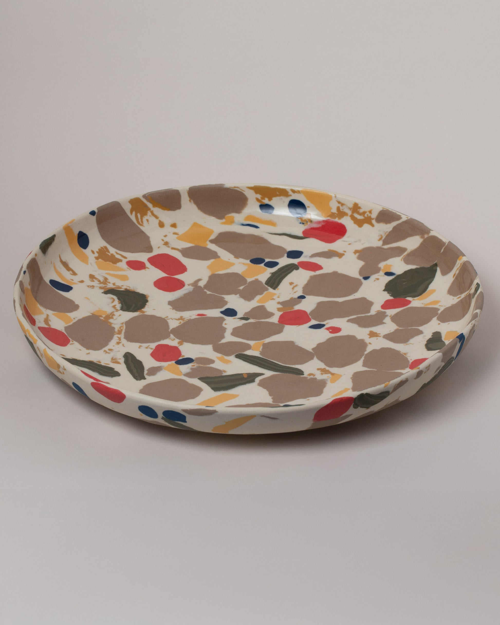 Closeup details of the Slush Club Nerikomi Platter No. 102 on light color background.