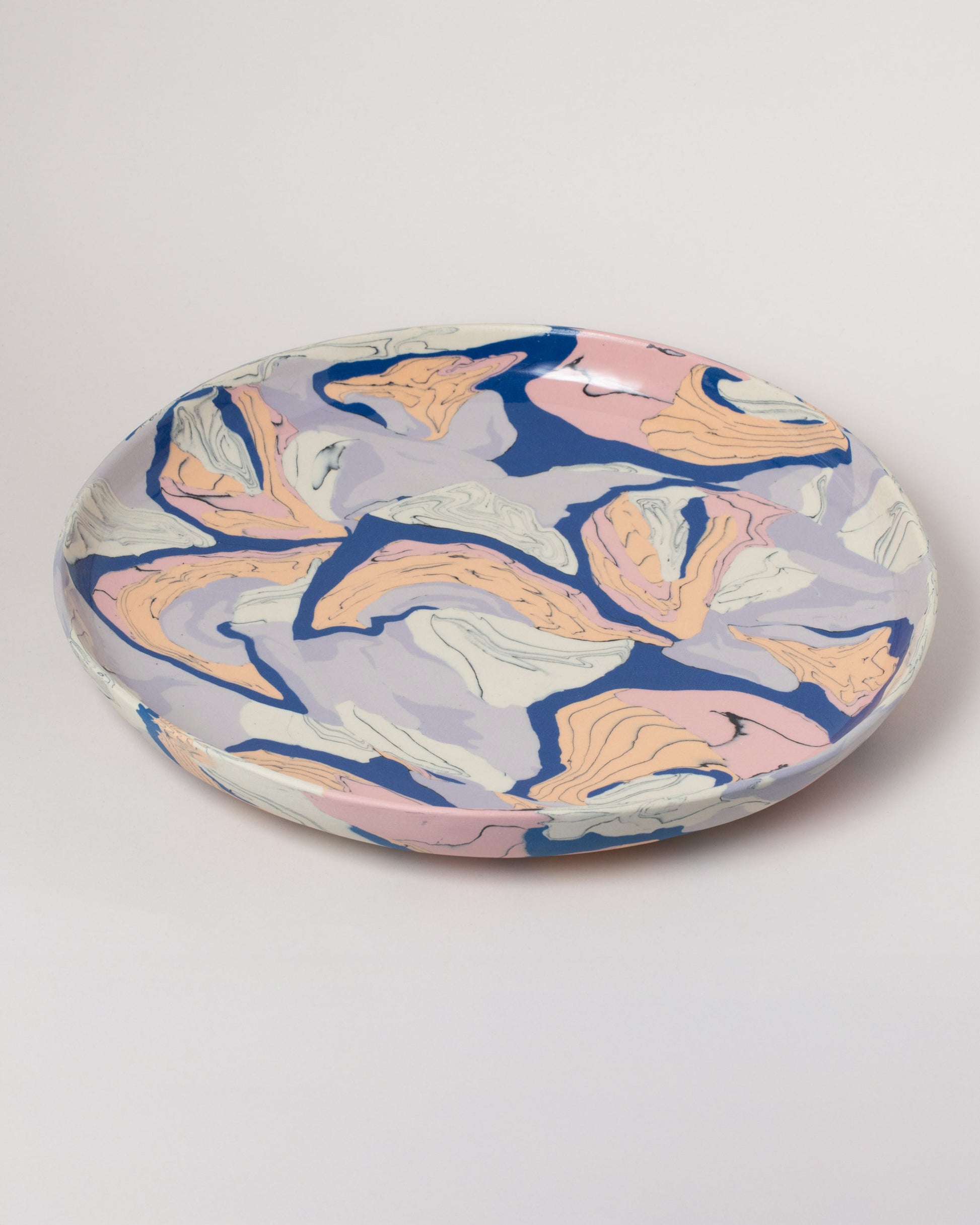 Closeup details of the Slush Club Nerikomi Platter No. 103 on light color background.