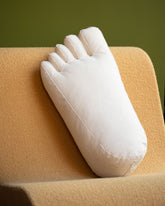 Styled image featuring the Sohn Cotton Canvas Soft Sculpture Foot Pillow.