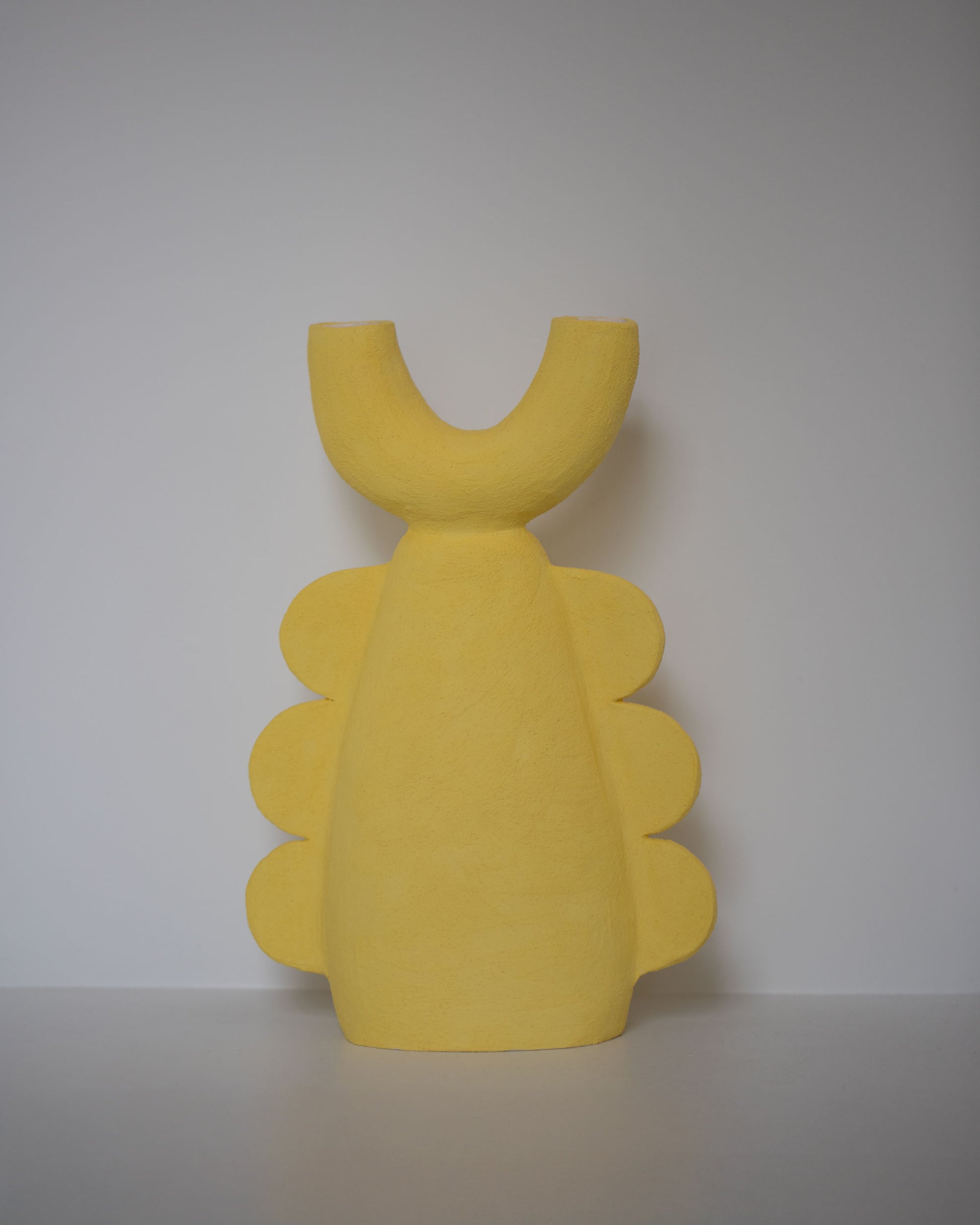 Stephanie Phillips Dimanche Sculpture on light color background.