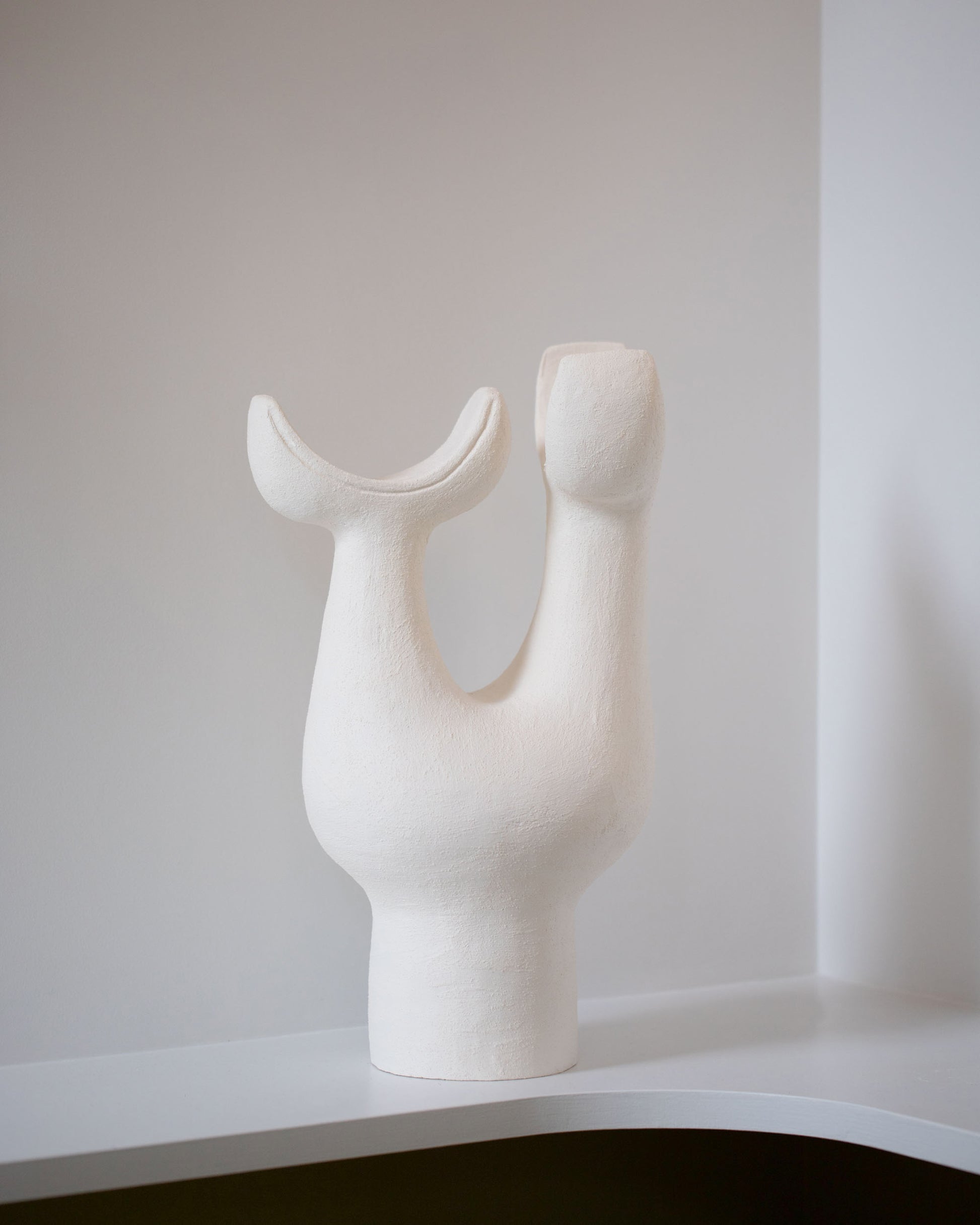 Closeup details of the Stephanie Phillips Lovis Sculpture on light color background.