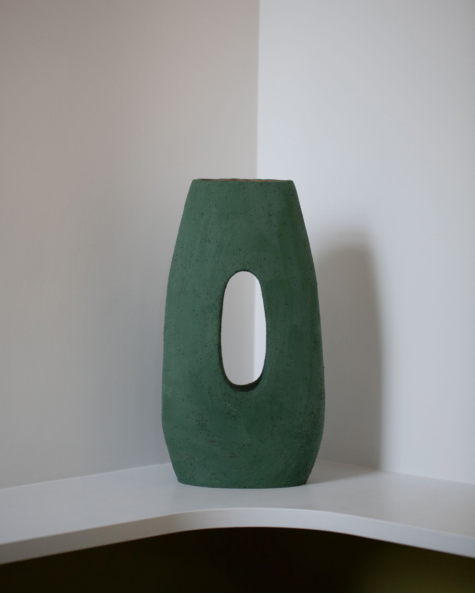 Stephanie Phillips Orta Tall Sculpture on light color background.