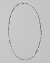 CRZM Sterling Silver Infinity Chain Necklace on light color background.