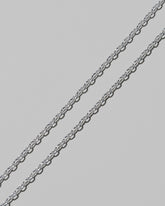 Closeup details of the CRZM 2.5mm Sterling Silver Short Loop Chain Necklace on light color background.