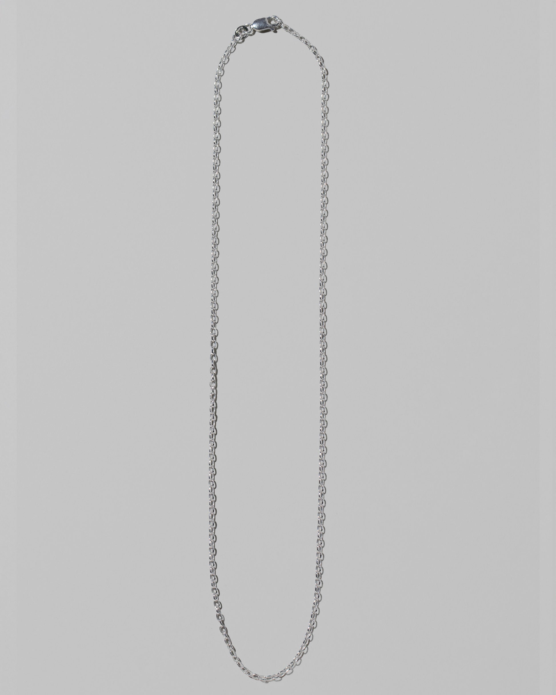 CRZM 2mm Sterling Silver Short Loop Chain Necklace on light color background.