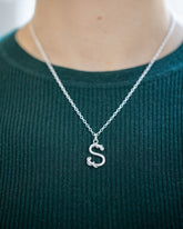 CRZM CRZM 2mm Sterling Silver Short Loop Chain Necklace and CRZM Letter S Medium Sterling Silver Letter Charms on model.