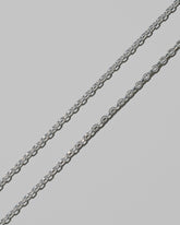Closeup details of the CRZM 3.2mm Sterling Silver Short Loop Chain Necklace on light color background.