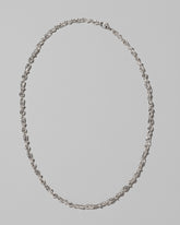 CRZM Sterling Silver Torsional Chain Necklace on light color background.