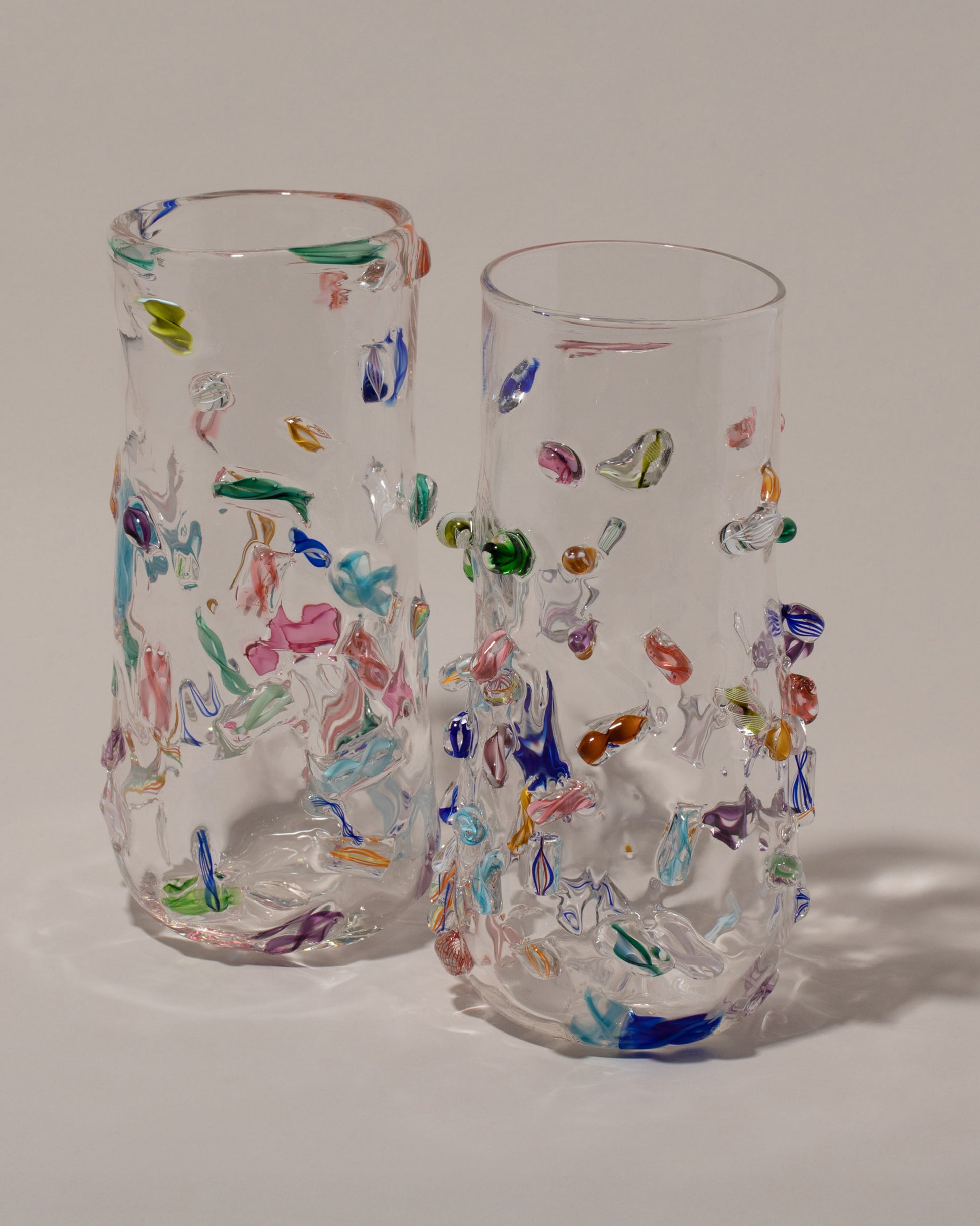 Closeup details of the Stover Glass Tall Cane Vases on light color background.