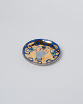 Suzanne Sullivan Hand & Eyes A Continuous Scene Vices Dish on light color background.