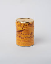 Suzanne Sullivan Café du Monde Coffee Can on light color background.