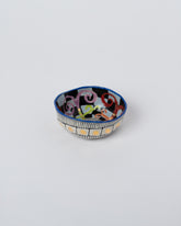 Suzanne Sullivan Spiral Compatible Backgrounds Pinch Bowl on light color background.